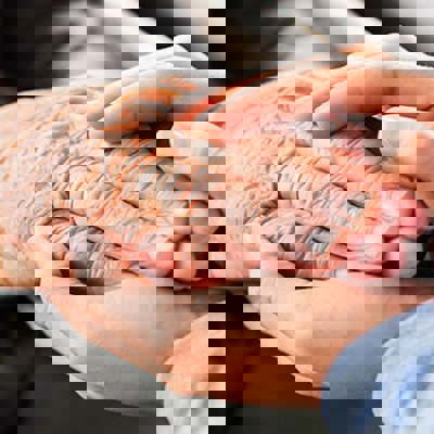 A picture of two people holding hands